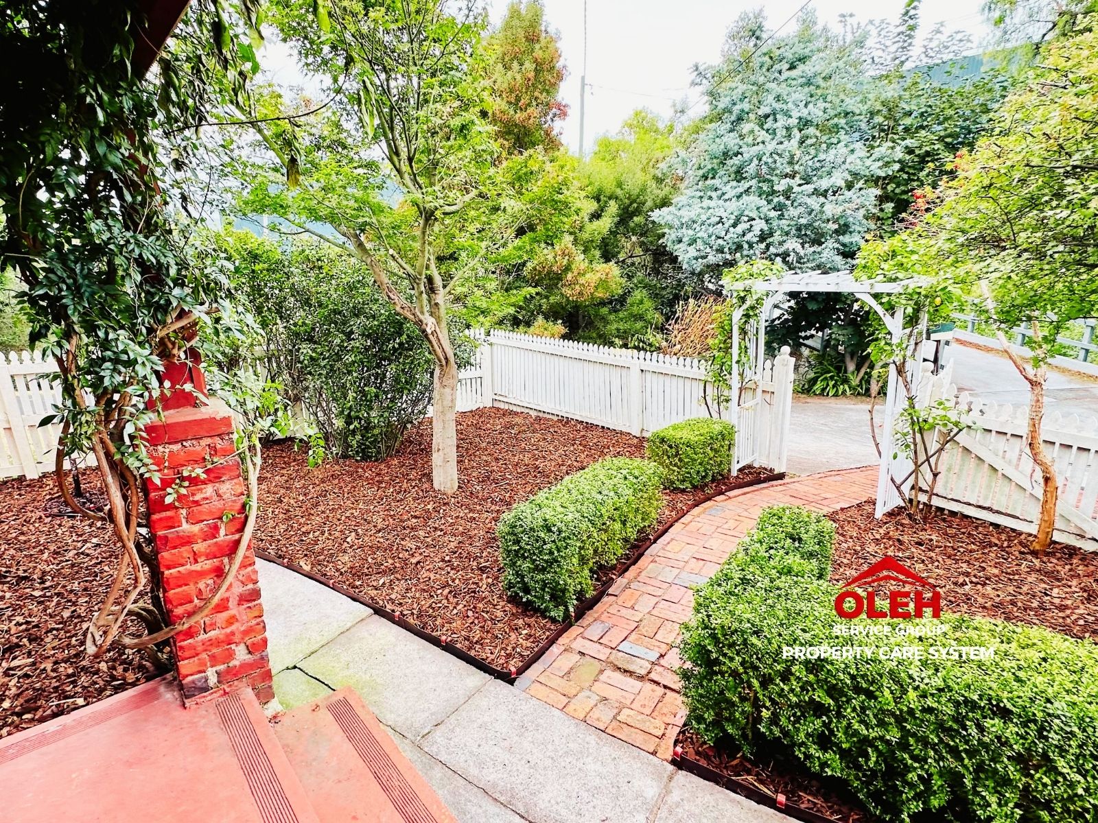Finished landscape improvement with garden edging planting and mulch in Hobart