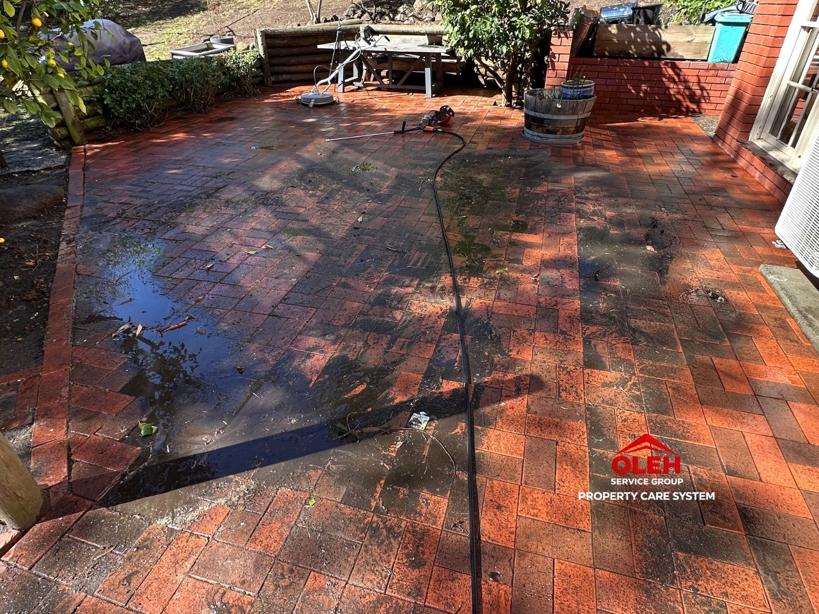Brick patio before pressure cleaning at a Hobart property