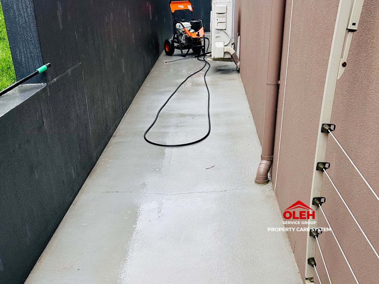 Clean concrete side path after pressure cleaning in Hobart