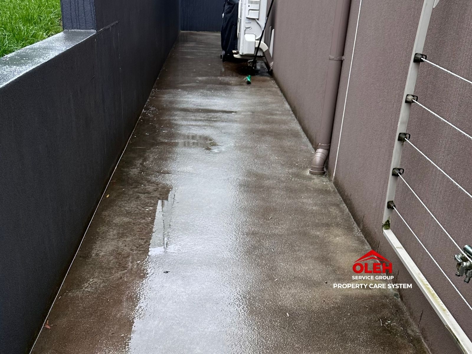 Concrete side path with surface dirt before cleaning in Hobart