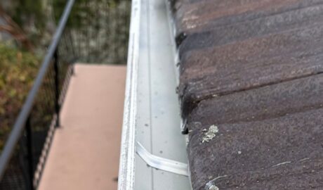 Repaired gutter and roof junction following water damage inspection in Hobart