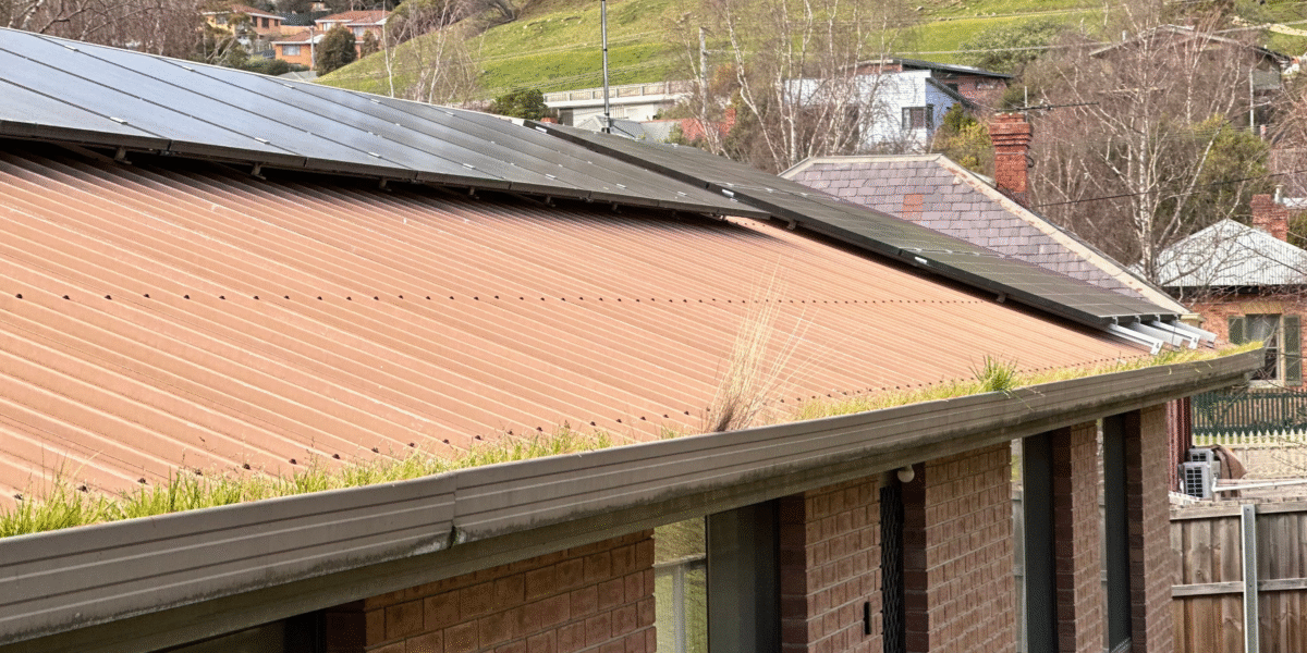 Metal roof and gutter system inspected for drainage gutter condition and maintenance in Hobart Tasmania