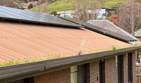 Metal roof and gutter system inspected for drainage gutter condition and maintenance in Hobart Tasmania