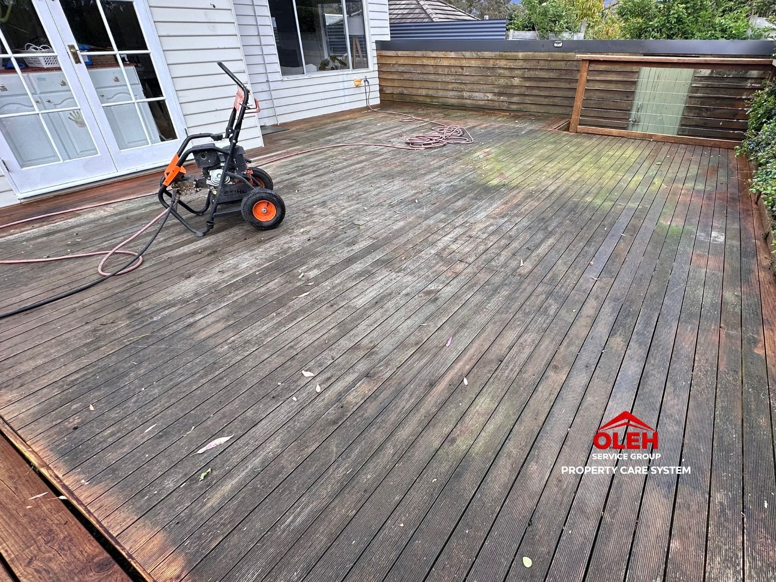 Weathered and dirty timber deck before cleaning in Hobart