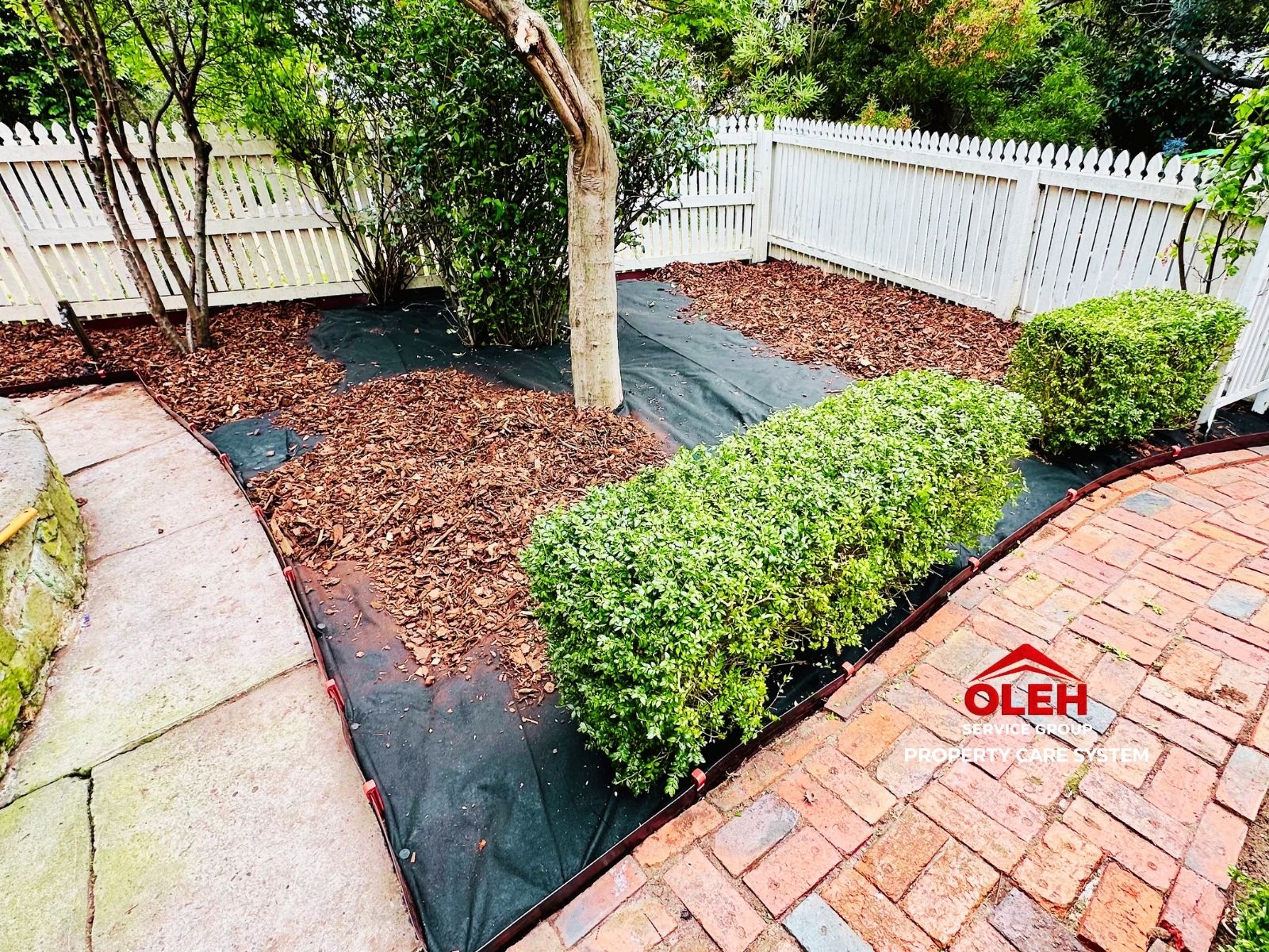 Weed control layer installed before landscape mulching in Hobart and Kingston
